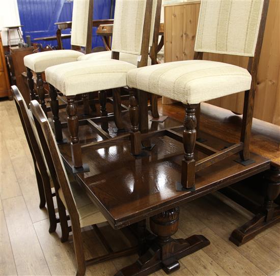 An oak draw leaf dining table and six chairs W.183cm